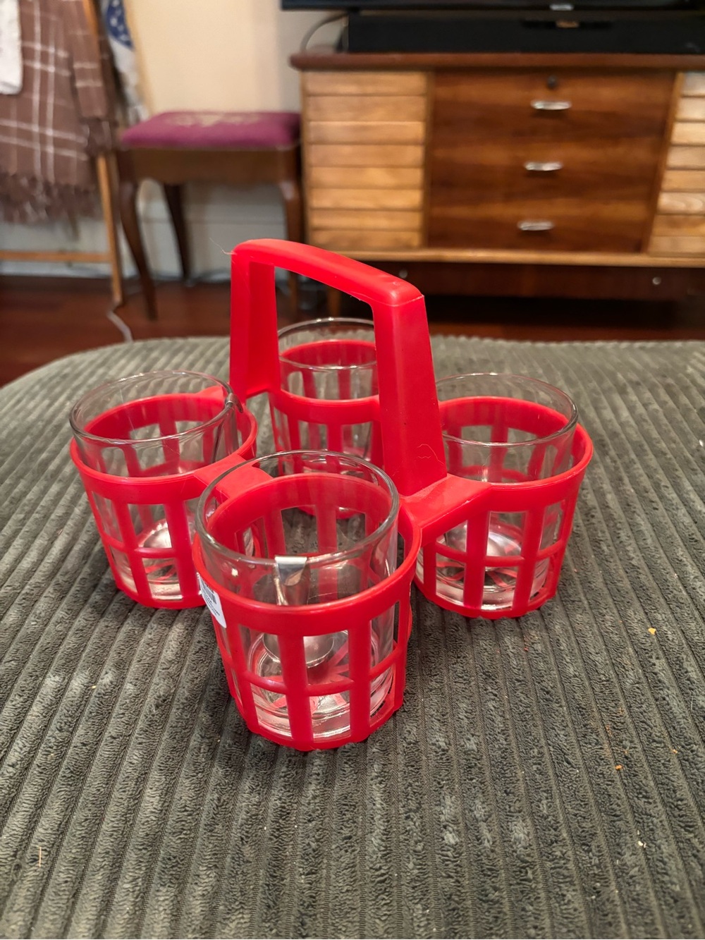 Crate & Barrel Red condiment caddy with four glass jars and metal spoons